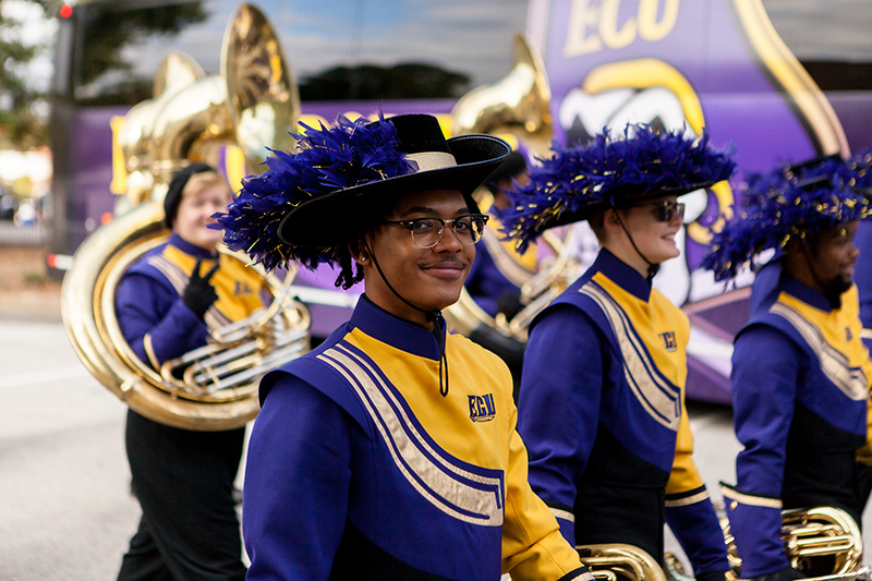 smiling member of the ECU Marching Pirates