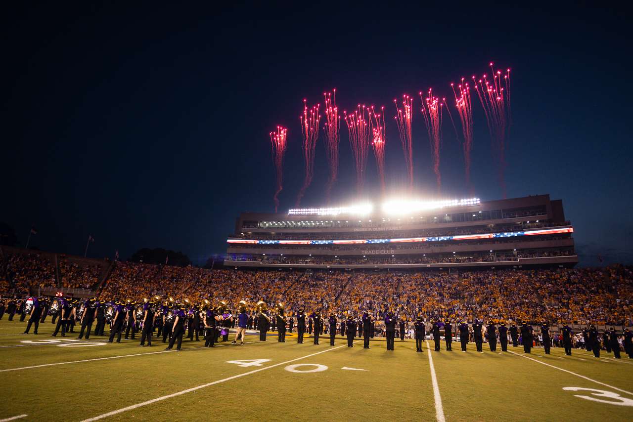 Fireworks explode above the press box at ECU while the Marching Pirates are on the field.
